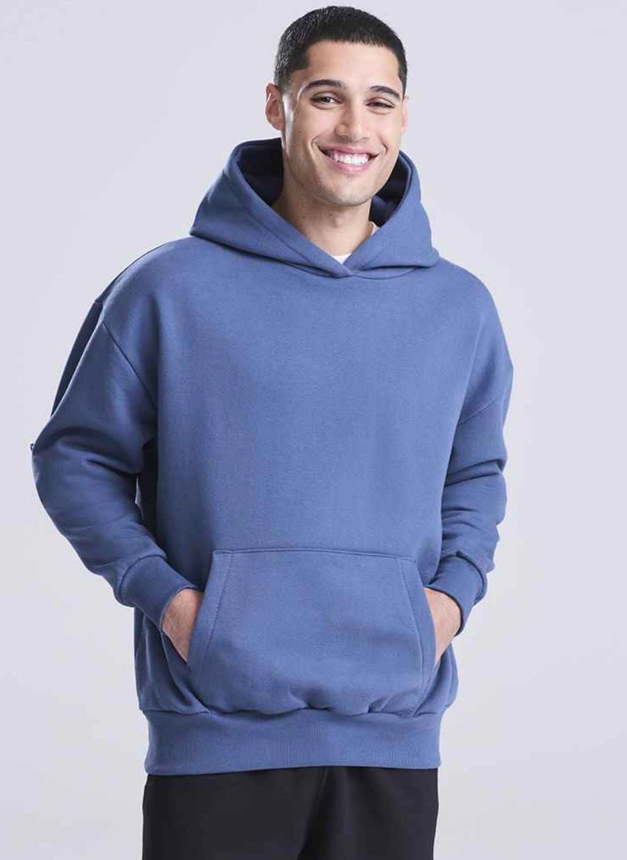 man wearing a dark blue hoodie looking at the camera
