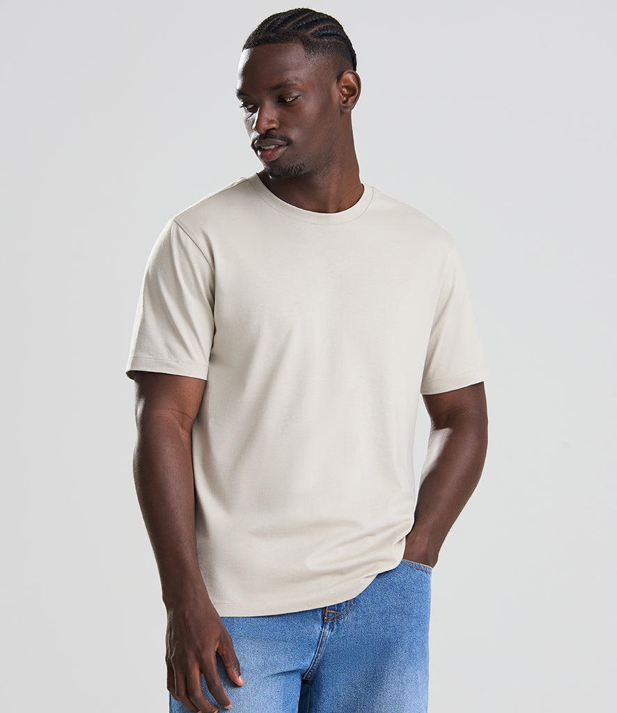 man in white shirt looking to the side facing the screen 