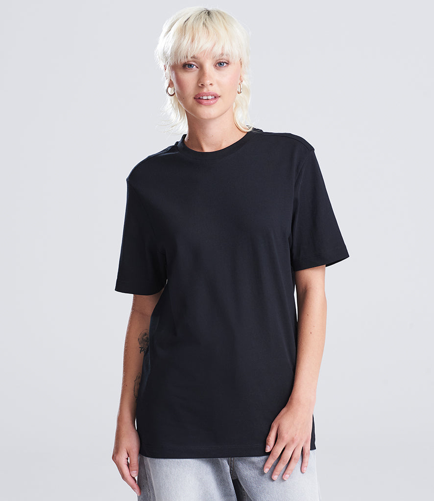 woman with black shirt facing the screen 