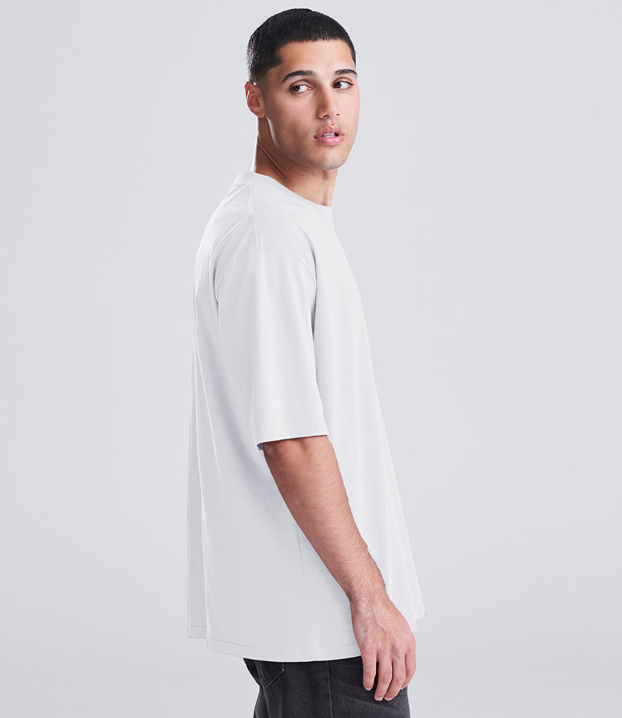 man in white shirt looking back at the screen