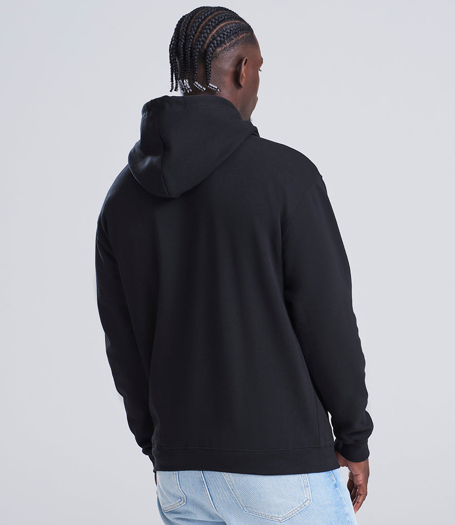 man wearing a black hoodie looking away from the camera