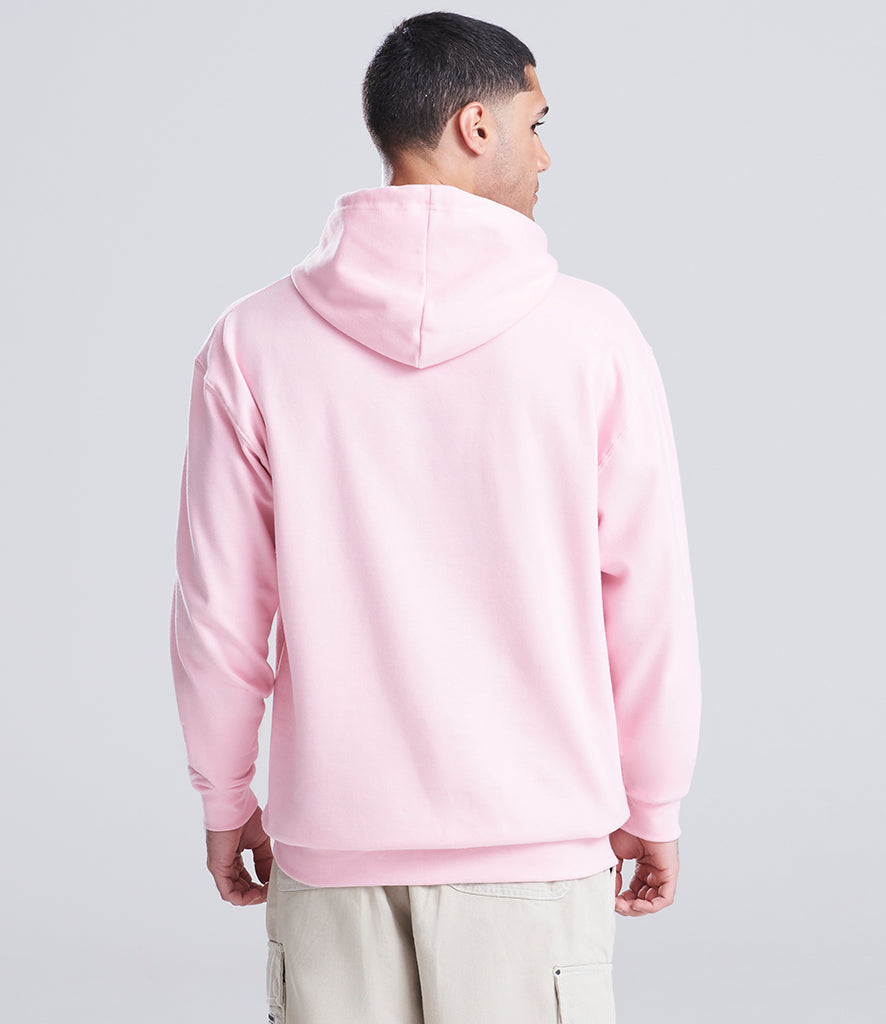 man wearing a pink hoodie looking away from the camera