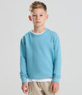 child wearing a bright-blue sweatshirt facing the camera