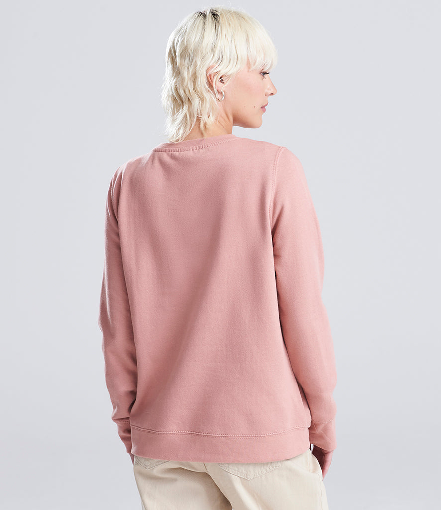 woman wearing a pink sweatshirt looking away from the camera