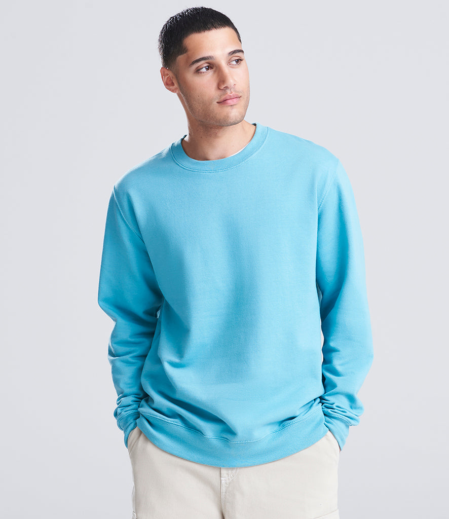 man wearing a blue sweatshirt looking at the camera 