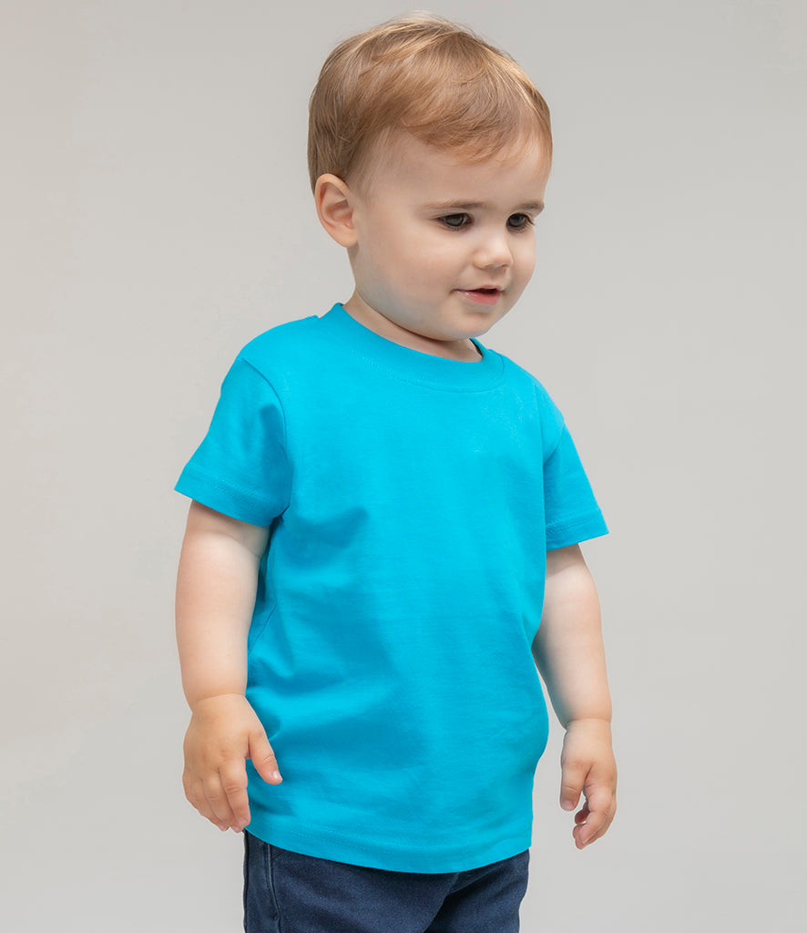 toddler wearing bright-blue t-shirt and blue trousers